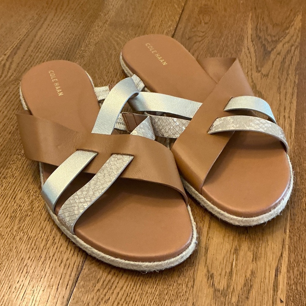 Woman’s Cole Haan tan/gold slide sandal. Size 9. Leather. New. Never worn! Cute!
